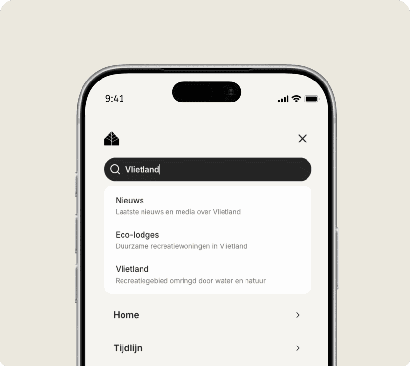 Zoeken op de telefoon: in het veld staat "Vlietland", eronder suggesties voor nieuws, eco-lodges en het recreatiegebied zelf.